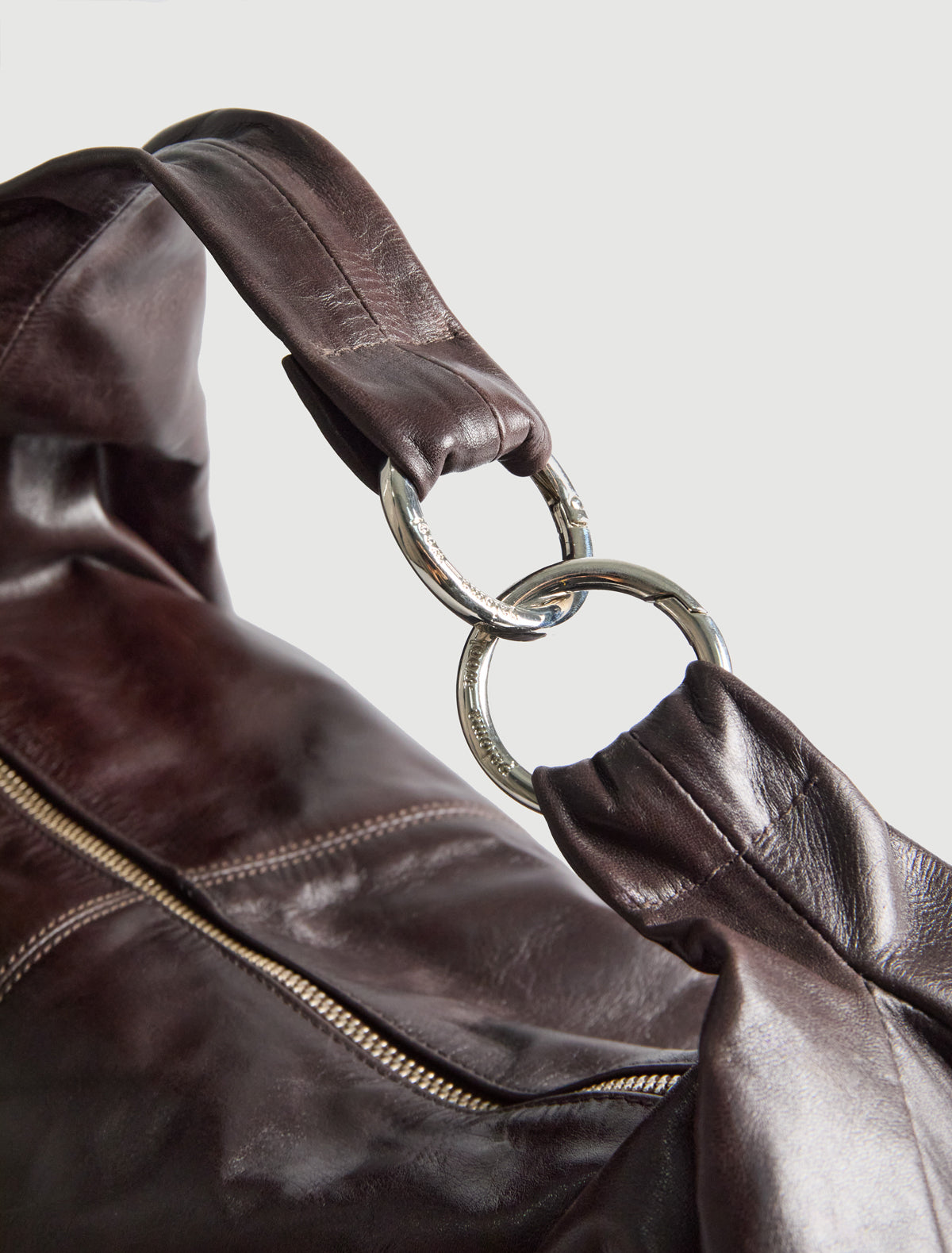 Dry elongated wrap around hobo style shoulder bag darkbrown