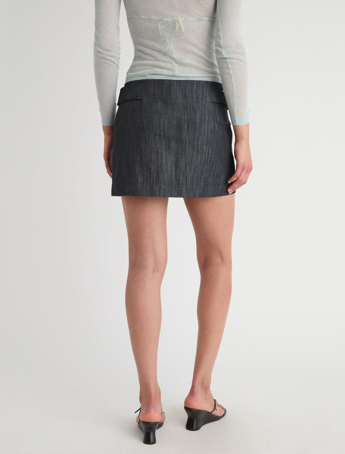 Deuna denim mini skirt side straps front zip closure
