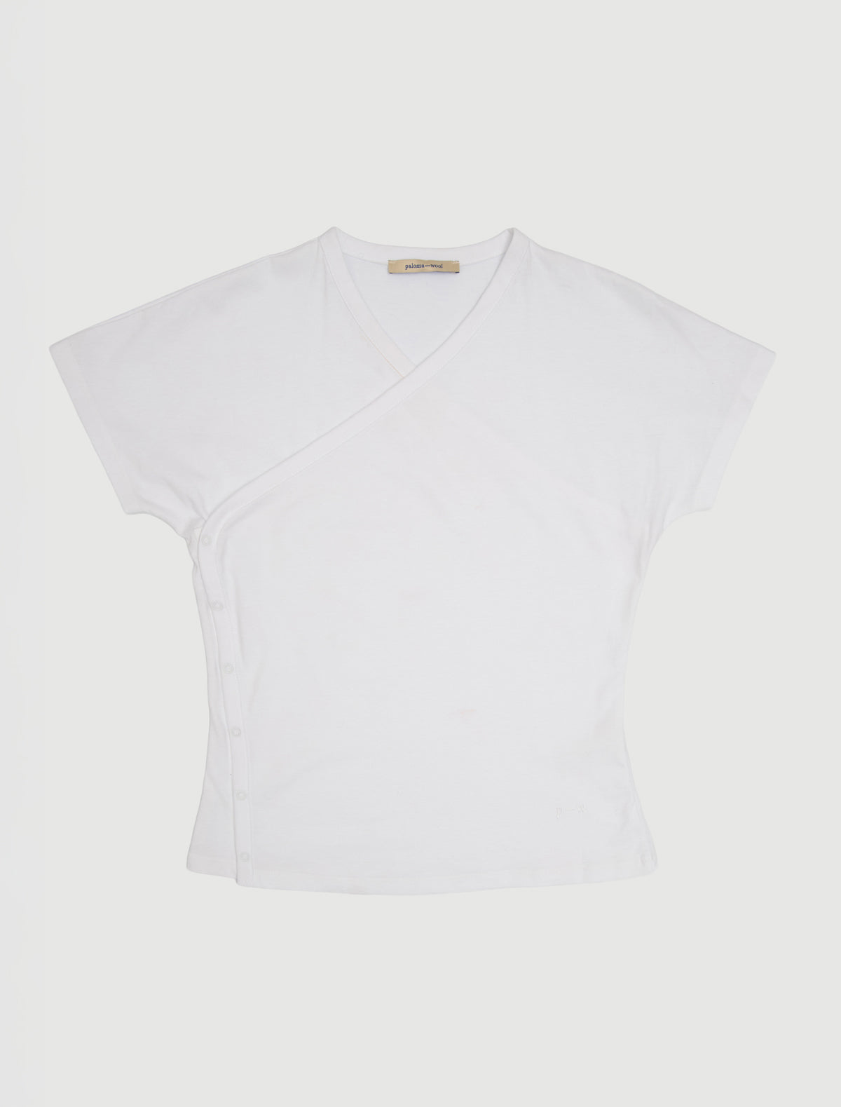 Olimpia crossed ranglan top snap closures embroidered detail white