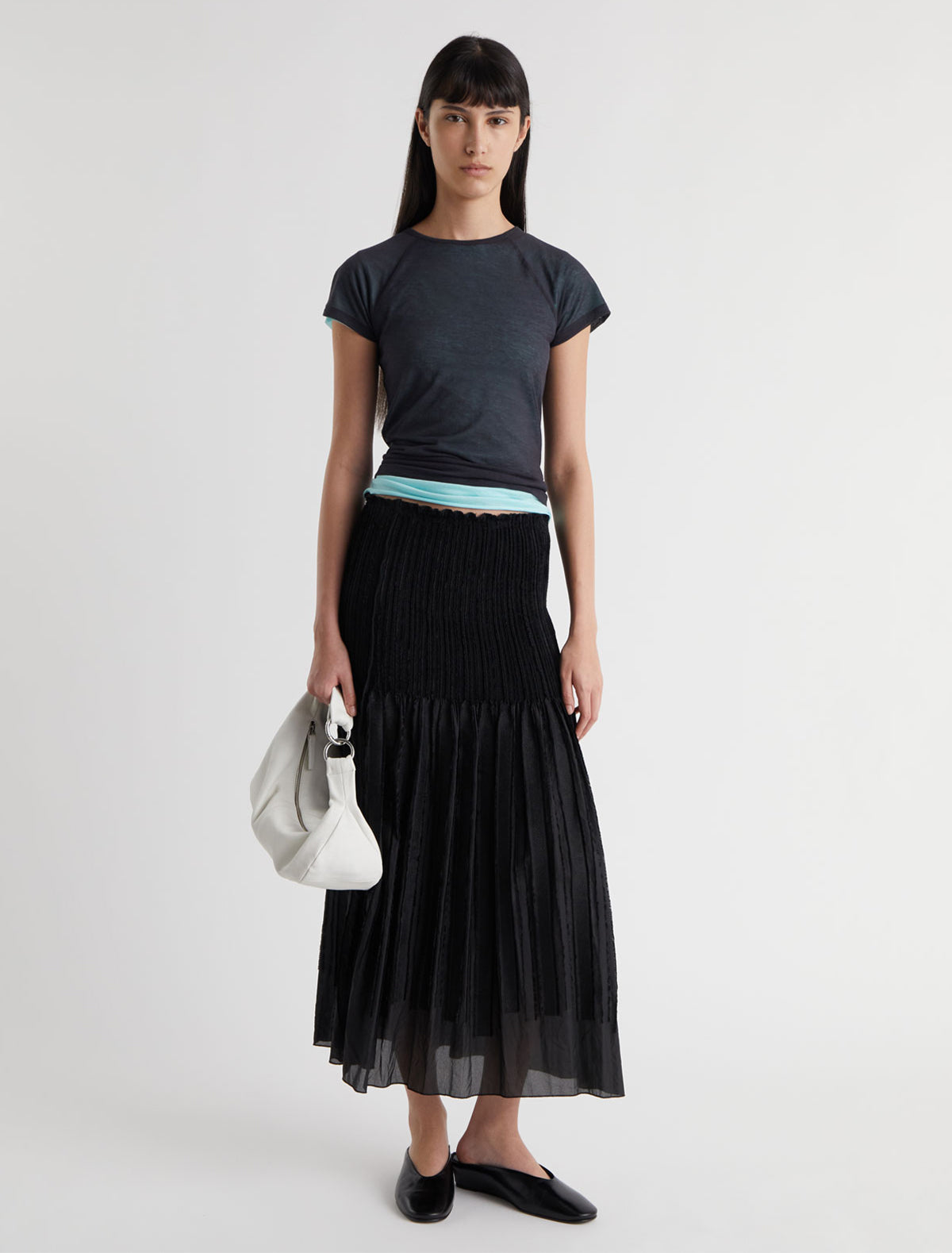 Long lupe long flared skirt fitted upper section volume bottom