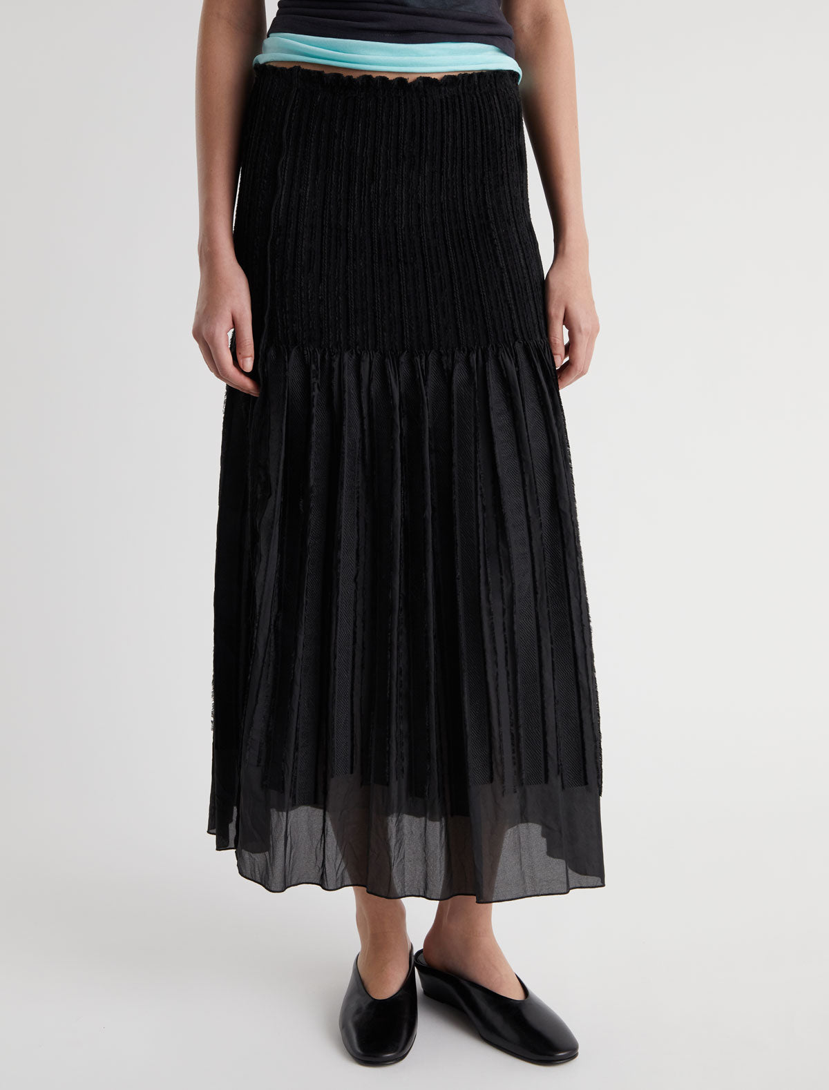 Long lupe long flared skirt fitted upper section volume bottom