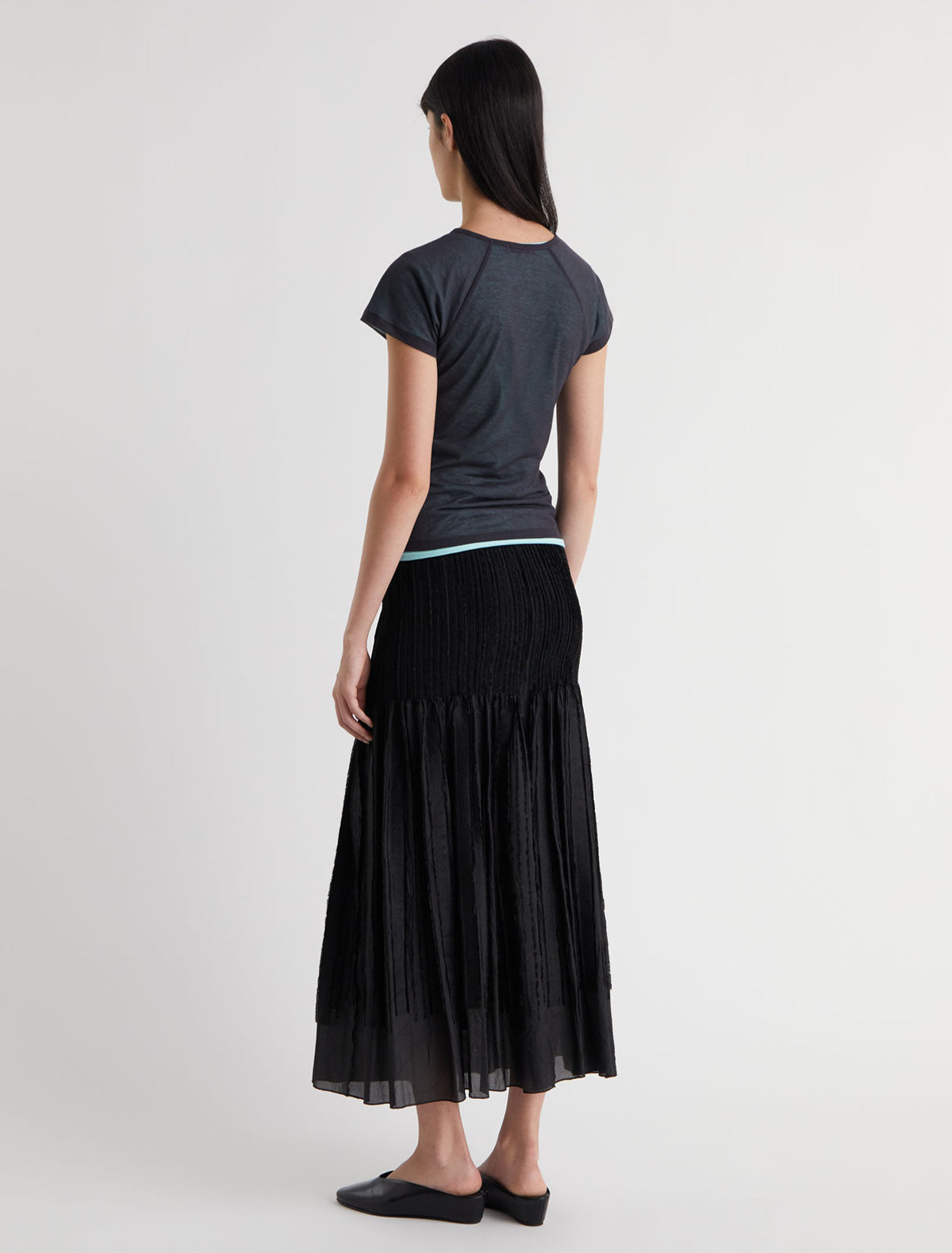 Long lupe long flared skirt fitted upper section volume bottom