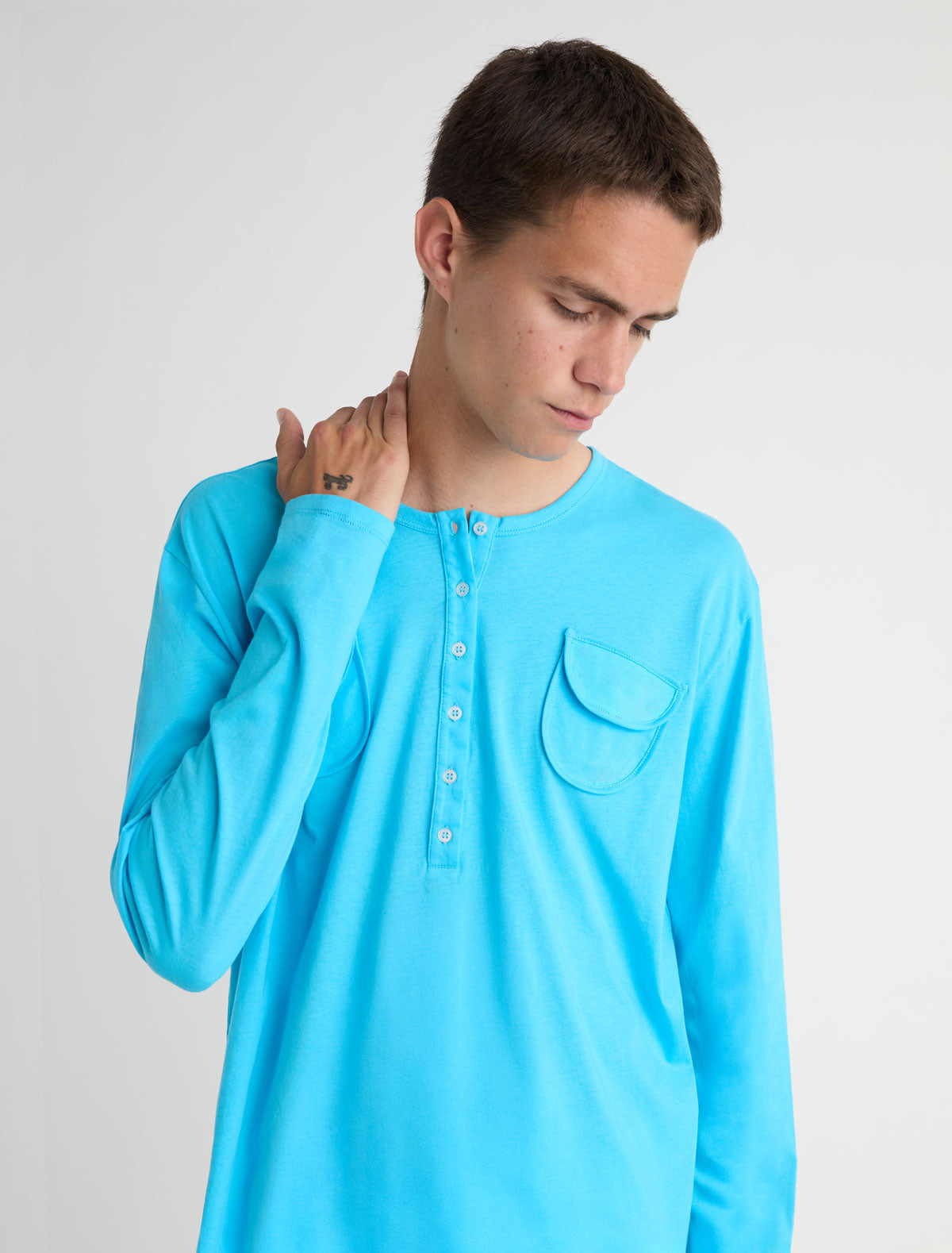 Nestor b long sleeve top crewneck chest pockets central button placket blue