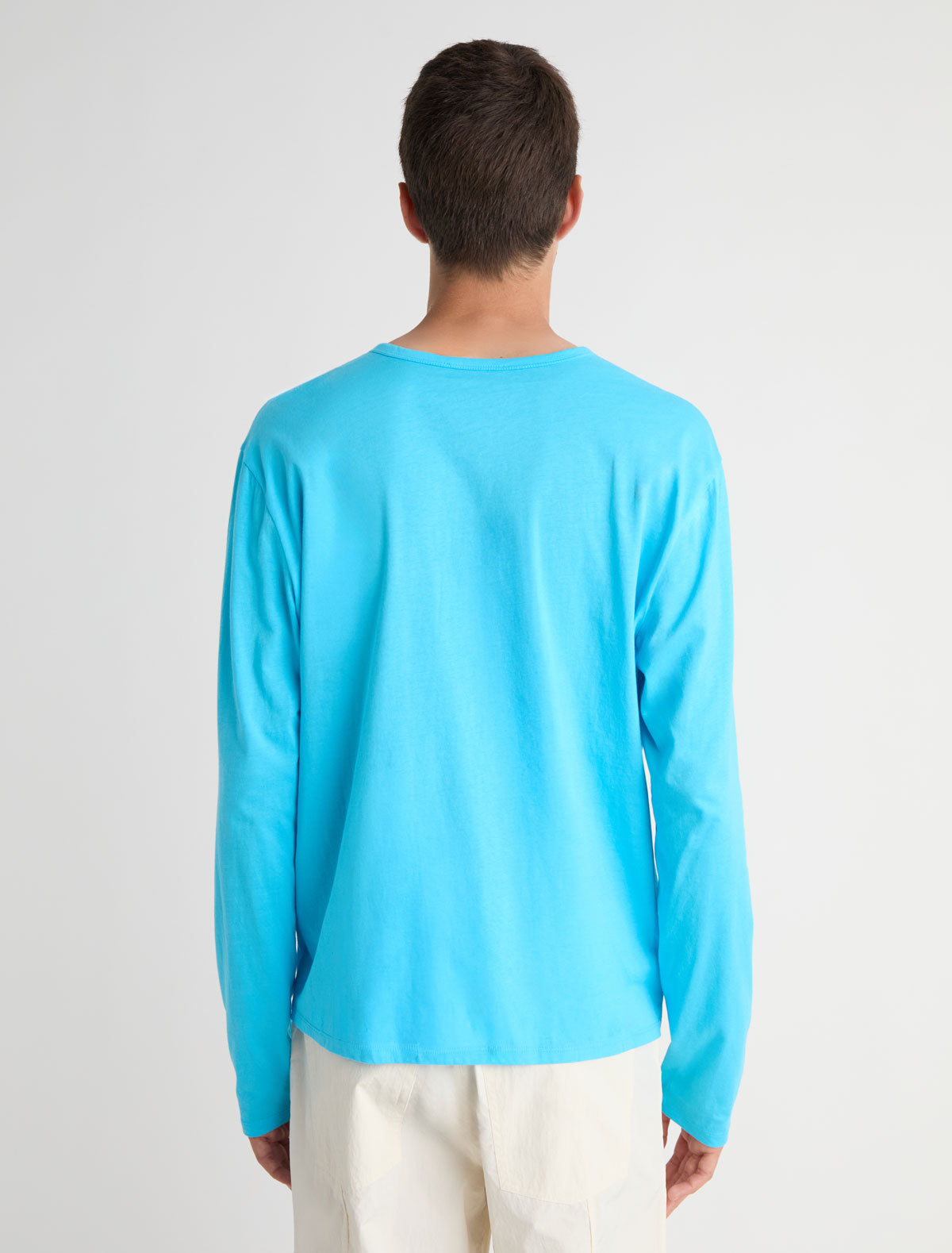 Nestor b long sleeve top crewneck chest pockets central button placket blue