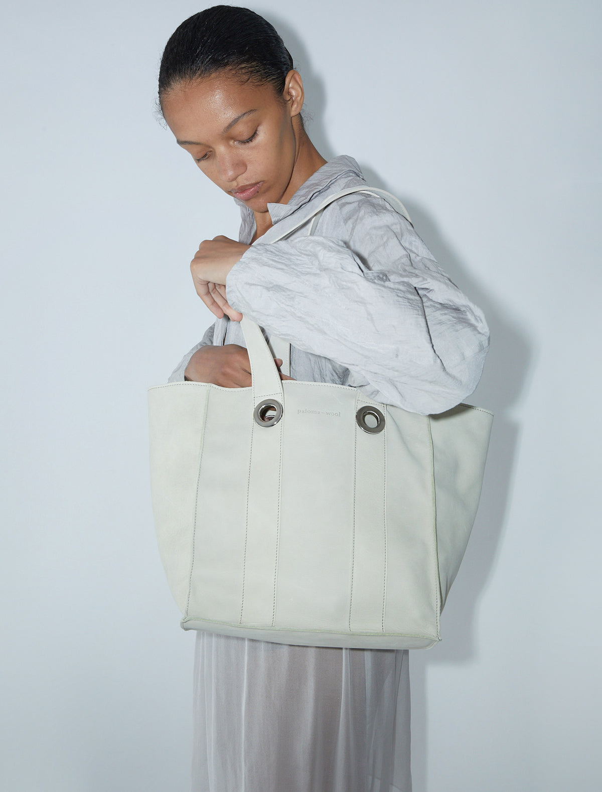 Milagros square shaped bucket bag eyelets detail ecru