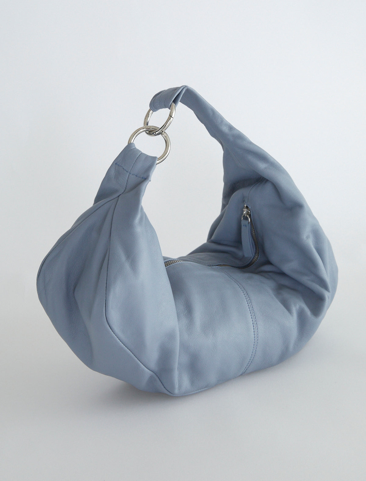 Dry elongated wrap around hobo style shoulder bag lightgreyishblue