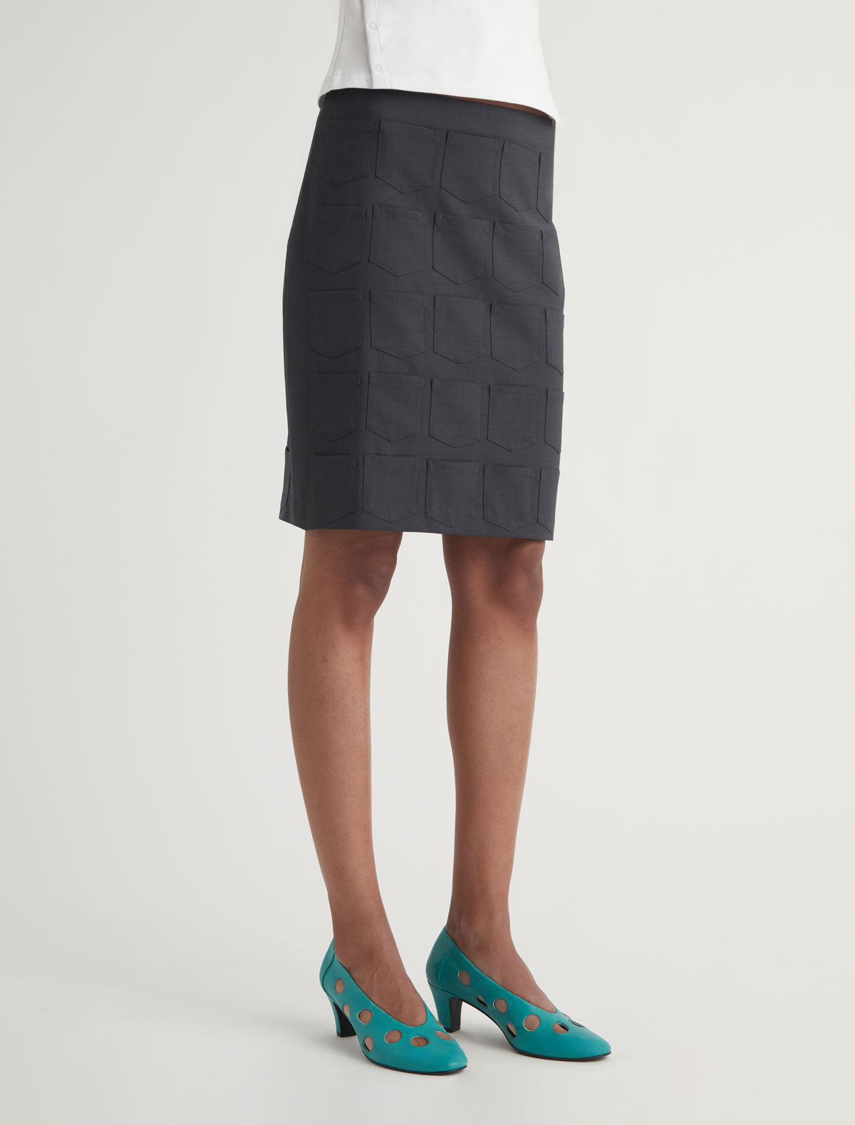 Quina pockets mid length skirt mini pockets detail