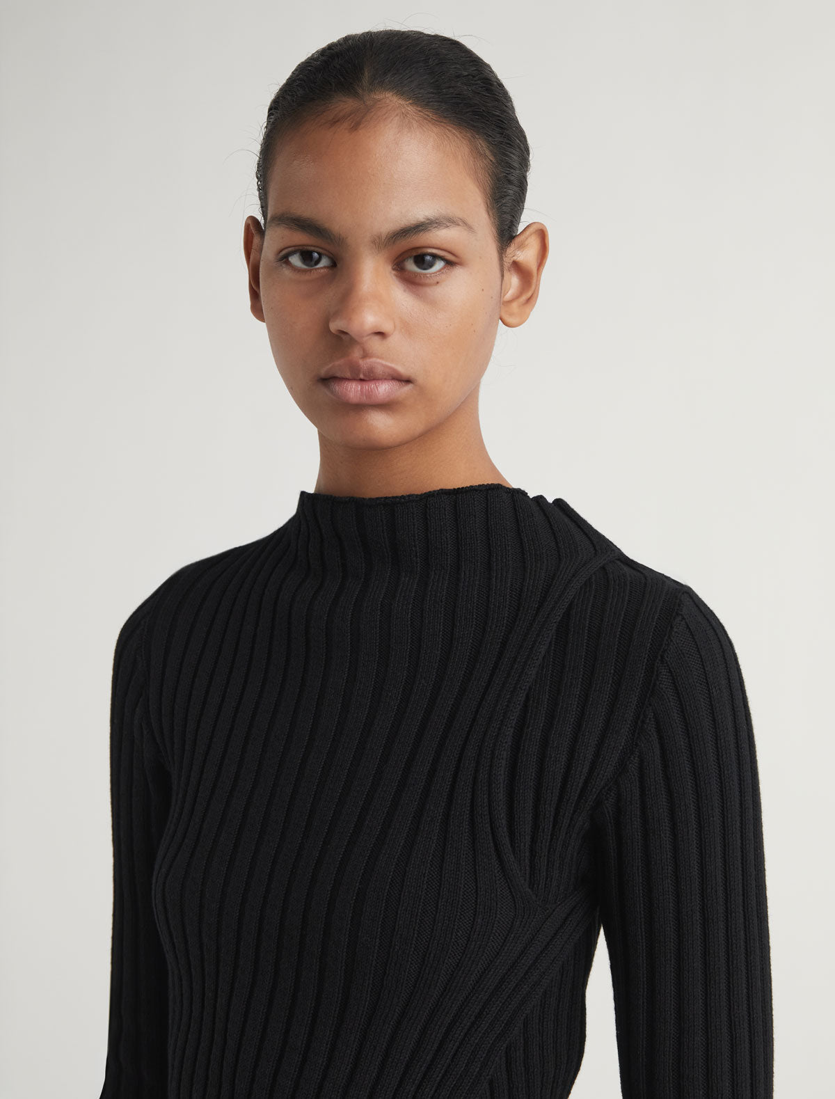 Esmolar long sleeved ribbed knit top overlaping neckline