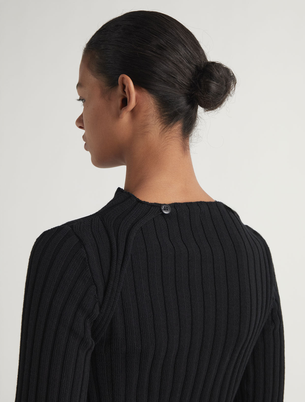 Esmolar long sleeved ribbed knit top overlaping neckline
