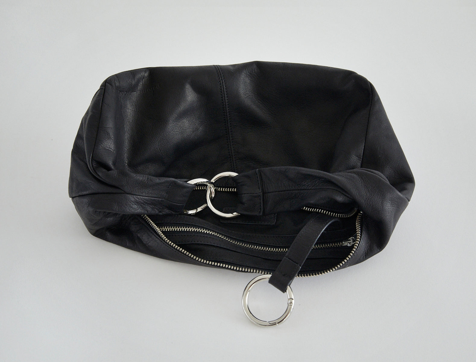 Mini dry elongated wrap around hobo style bag black