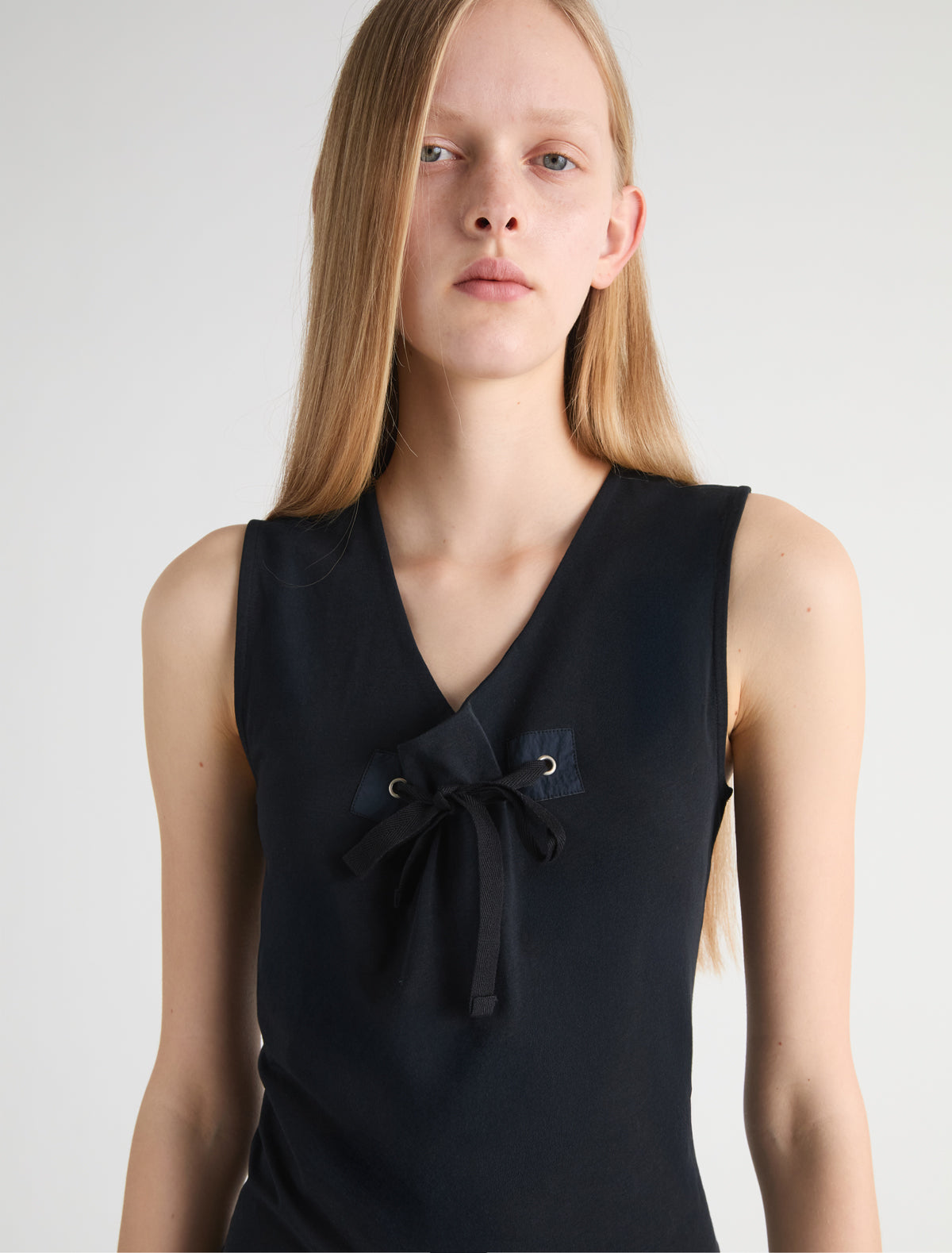 Manir sleeveless top chest patch eyelet adjustable strap black
